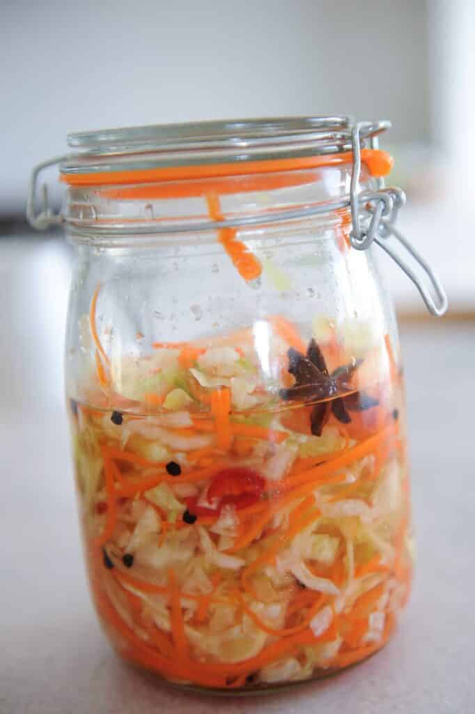 pickled vegetables with star anise in glass jar