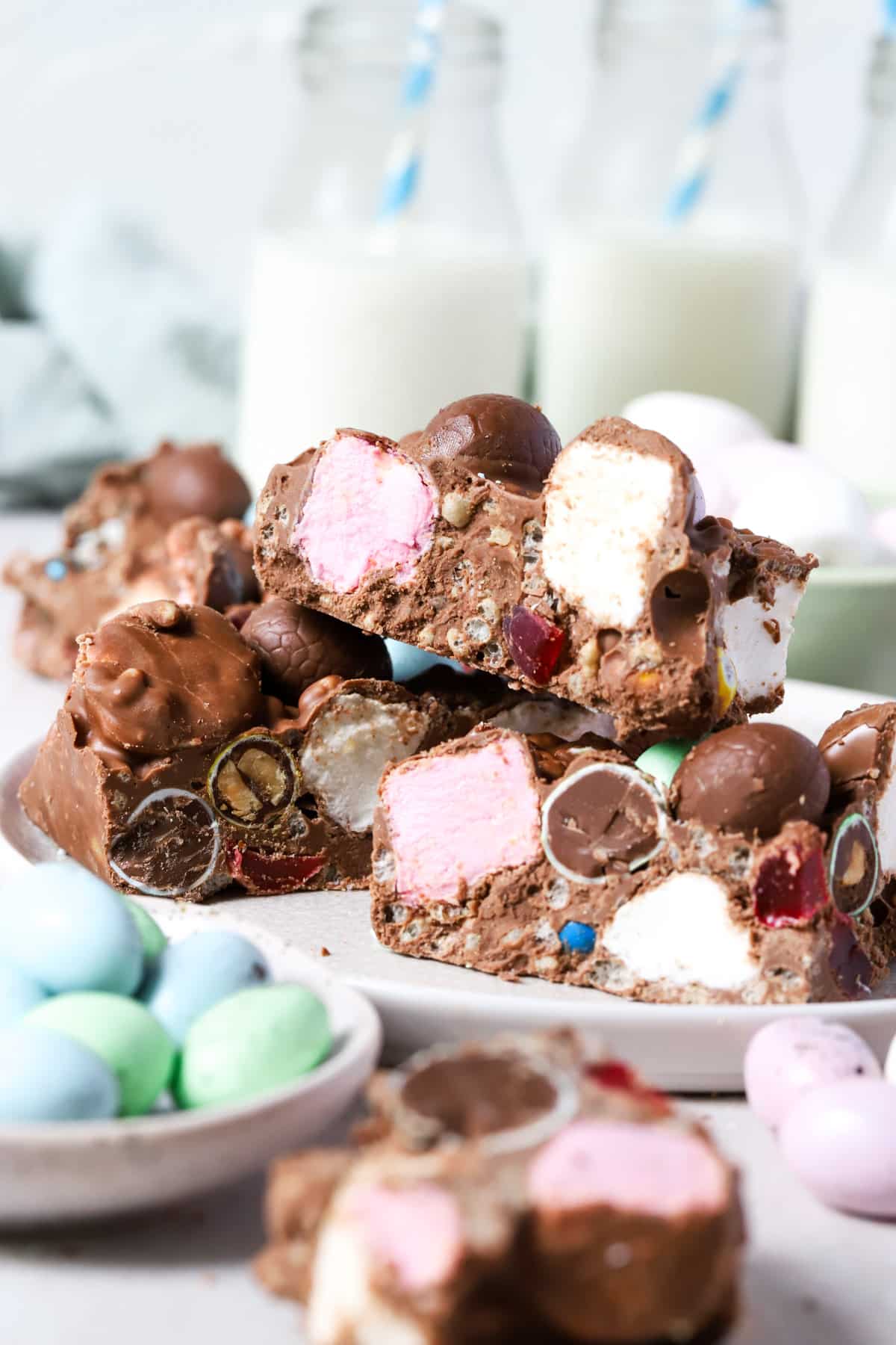 a plate with rocky road, marshmallows and mini Easter eggs