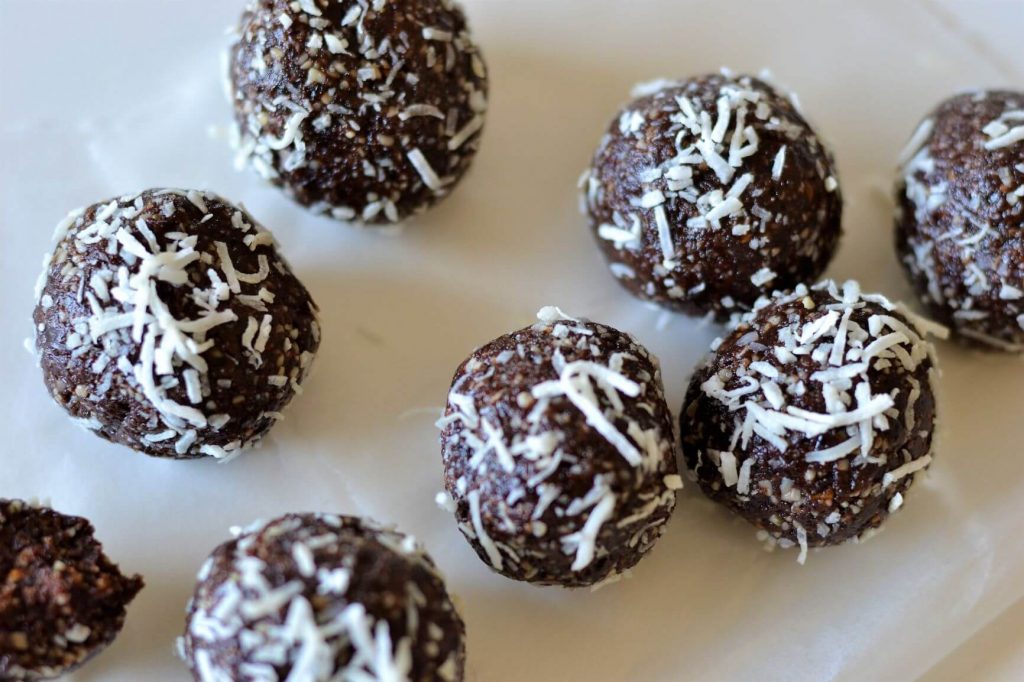 top view of chocolate balls coated in coconut