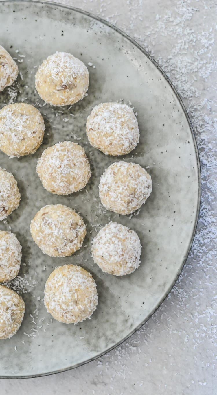 top view of lemon bliss balls on a grey plate