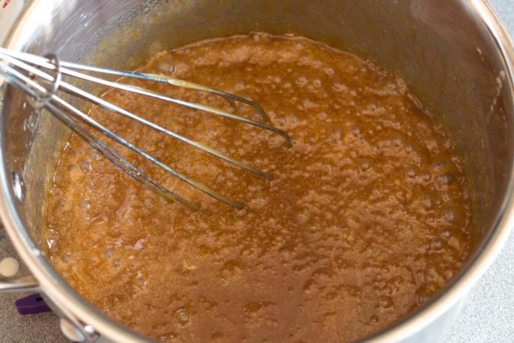 top view of caramel bubbling in saucepan