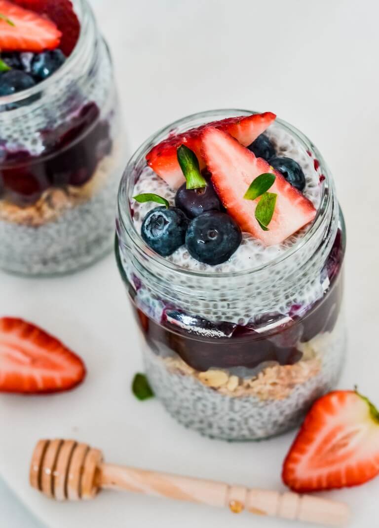 chia pudding in glass jar topped with berries