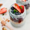 top view of chia pudding in glass jar with berries