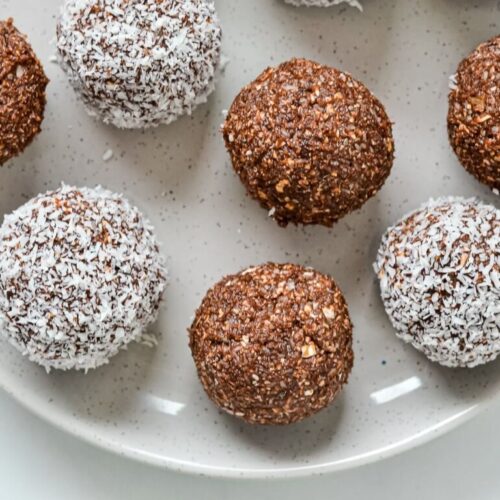 top view of bliss balls on white plate