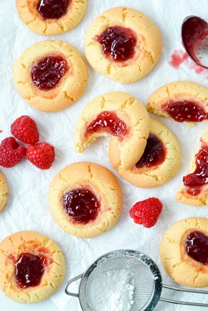 jam-drop-cookies-on-white-paper-with-raspberries