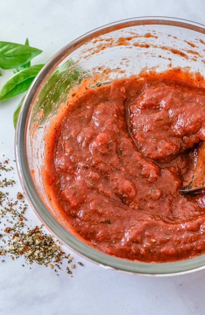 mixed-homemade-pizza-sauce-in-bowl-with-spoon
