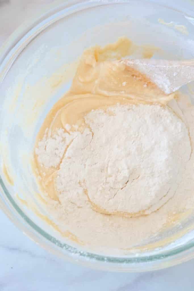 flour-added-to-butter-mixture-in-bowl