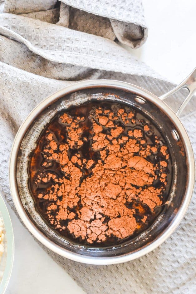 cocoa-added-to-melted-coconut-oil-in-pot