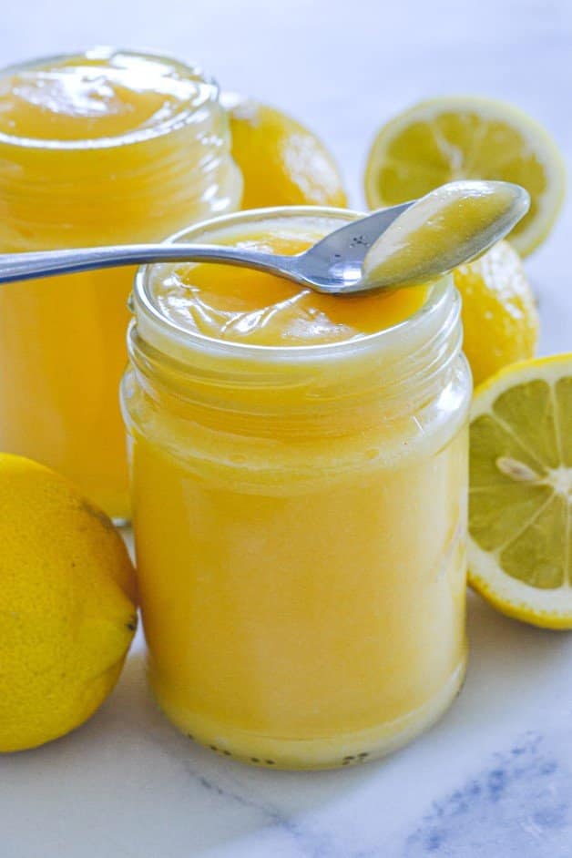 finished-lemon-spread-in-glass-jar-with-spoon-on-top