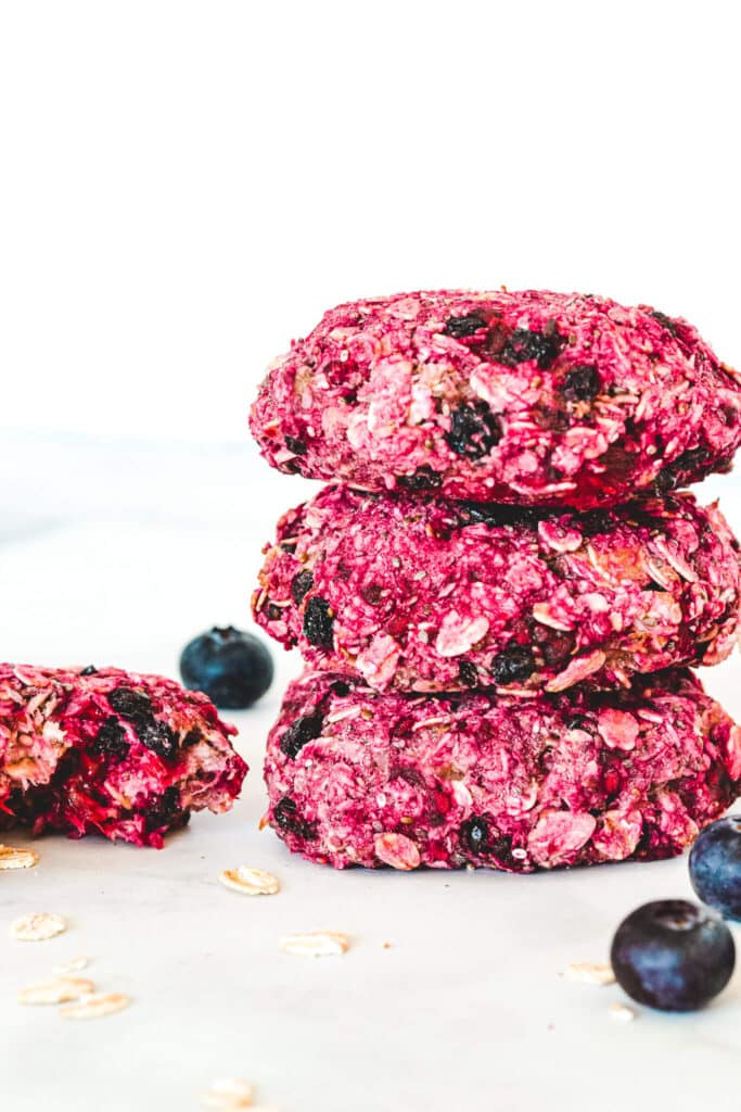 stack-of-berry-cookies-with-blueberries-and-oatmeal-flakes-on-bench