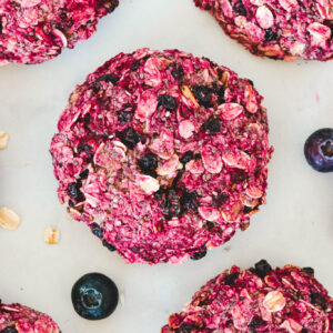 top-view-of-berry-cookies-on-white-board-with-oatmeal-flakes