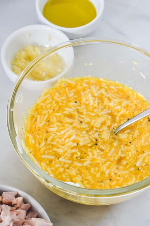 egg and cheese mixture in glass bowl