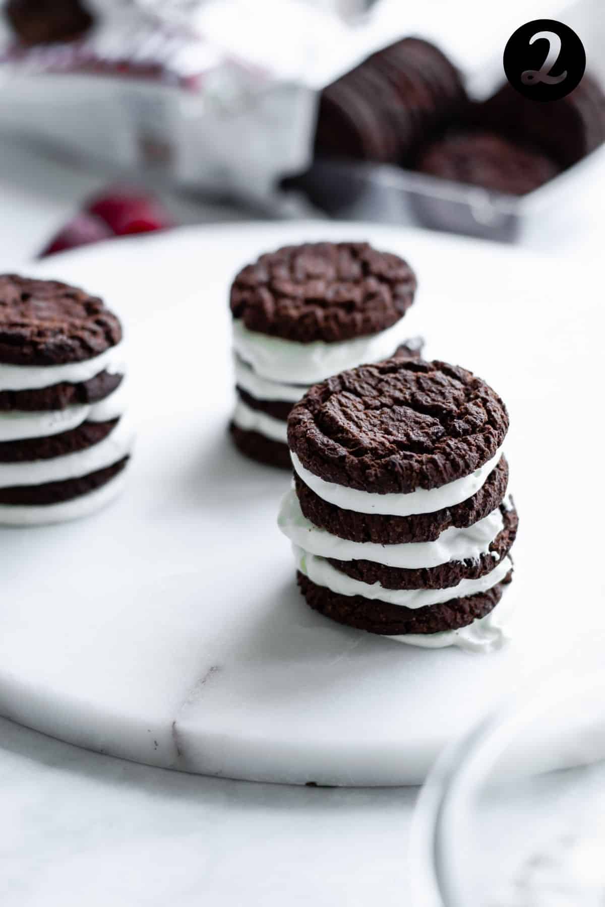 stacks of chocolate cookies and cream on white platter