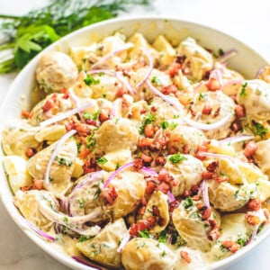 front view of finished potato salad in white bowl