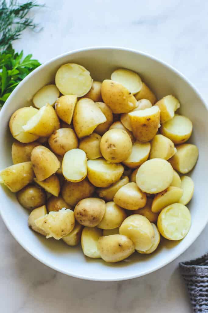 cooked potatoes in white bowl