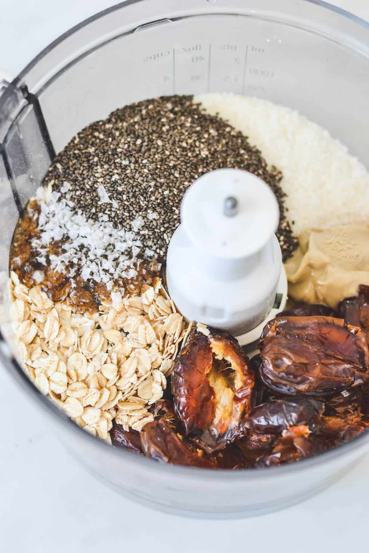 top view of all ingredients for caramel bliss balls in a food processor