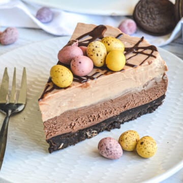 close up of a slice of chocolate cheesecake topped with Easter eggs