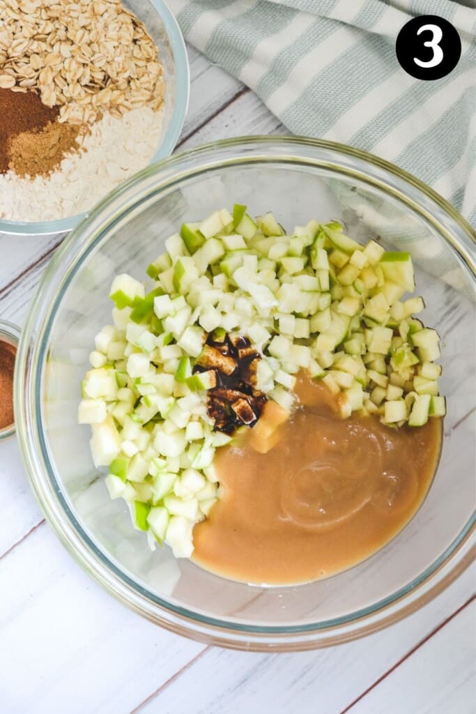 top view of chopped apple and ingredients in a glass bowl