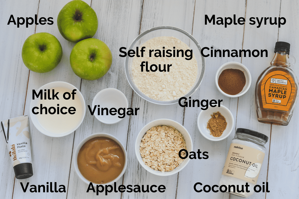 all ingredients for apple vegan muffins laid out on a white table