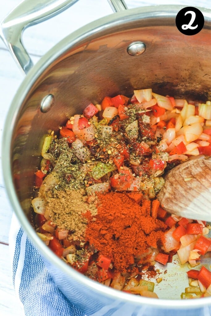 chopped vegetables and chilli spices in a saucepan.