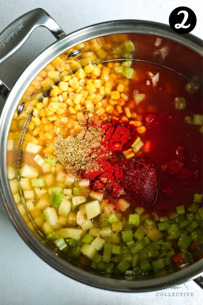 diced vegetables and soup ingredients in a large pot.