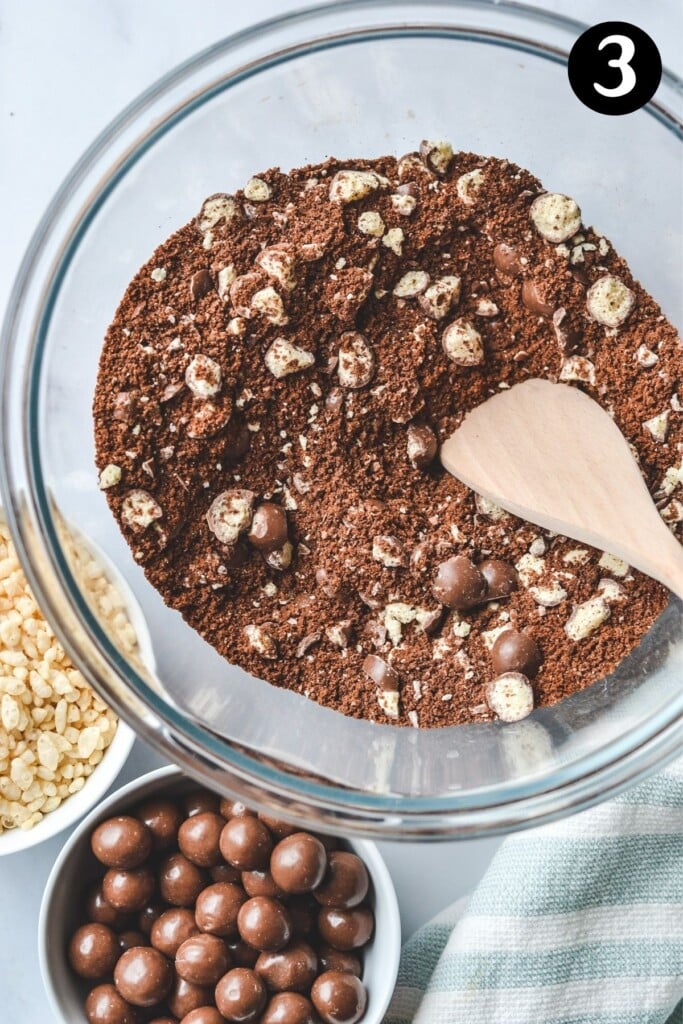 top view of dry ingredients and maltesers in a glass bowl