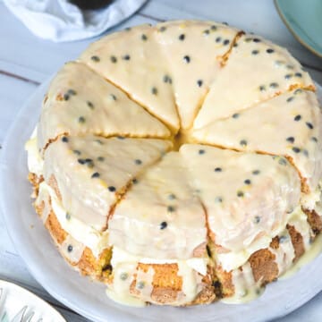 close up of a sponge cake topped with passion fruit icing