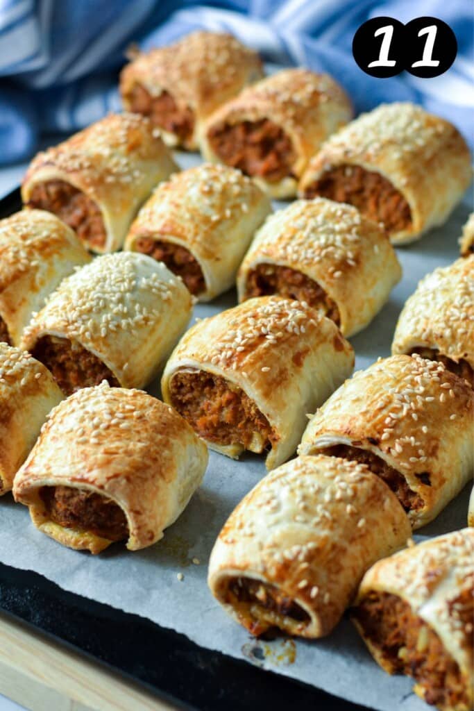 finished pork sausage rolls on a baking tray