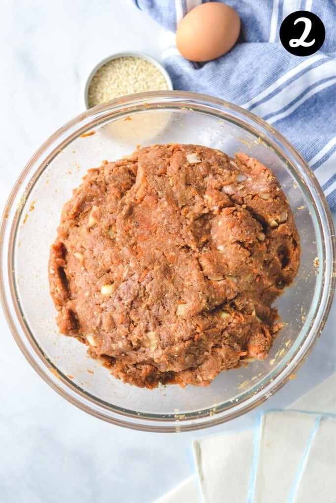 sausage roll filling mixture in a glass bowl