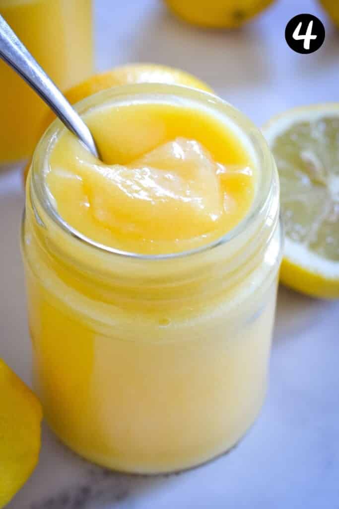 thickened lemon curd in a glass jar