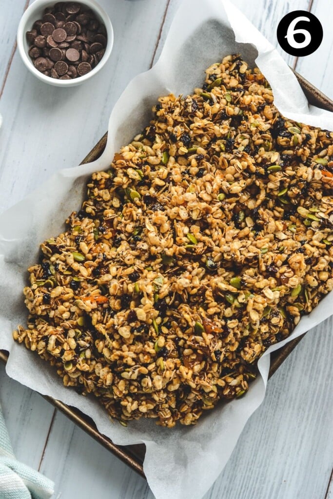 muesli bar mixture piled in a baking tin