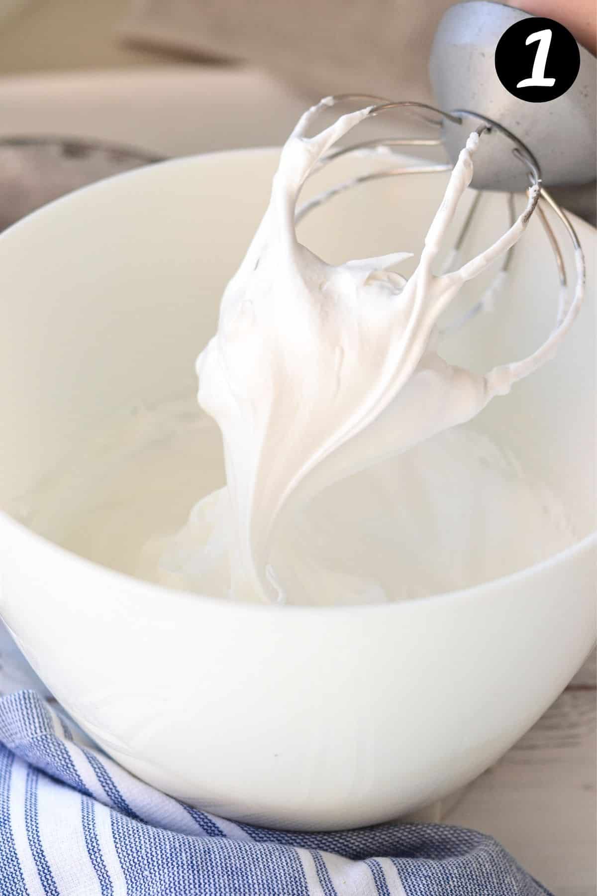 whipped meringue peaks on a whisk