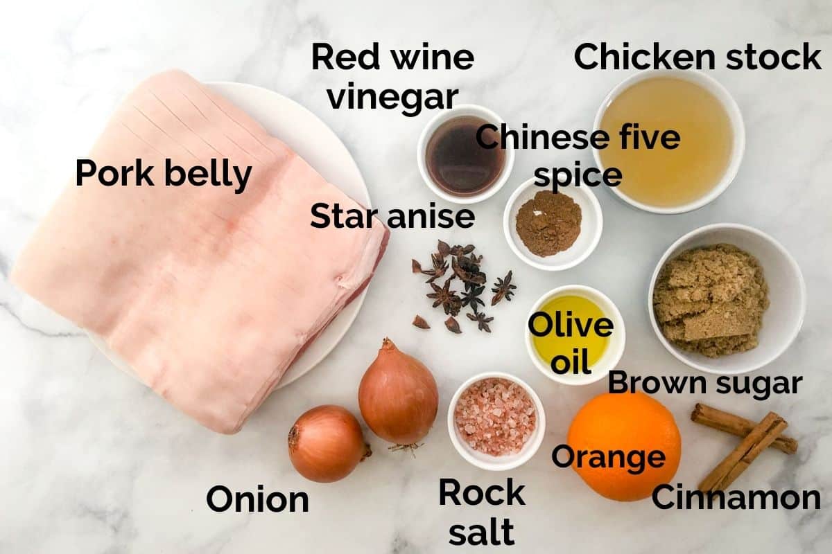 all ingredients for slow cooked pork belly laid out on a table