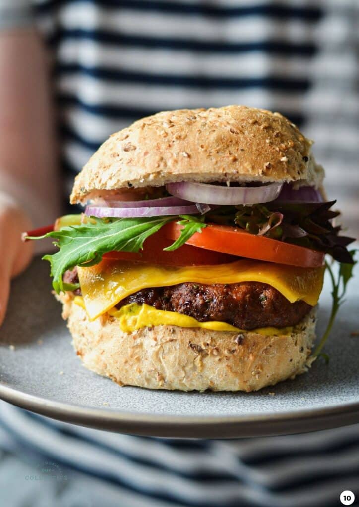 a close up of a turkey burger on a grey plate