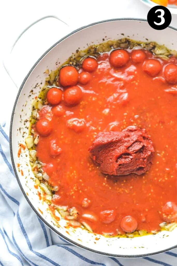 tomato and garlic sauce in a white pan
