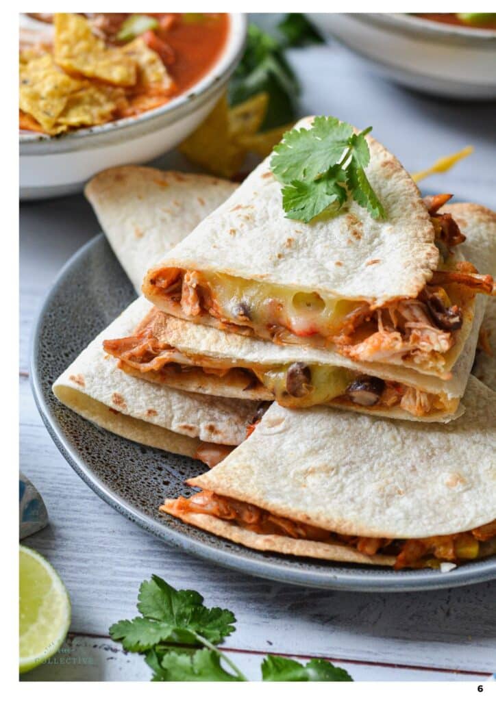chicken quesadillas stacked on a grey plate