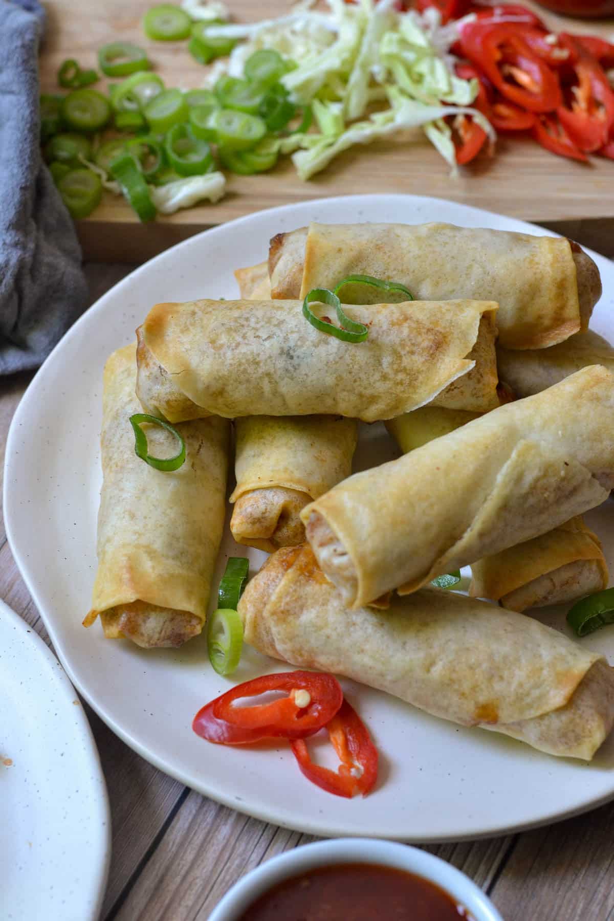 finished spring rolls on a white plate