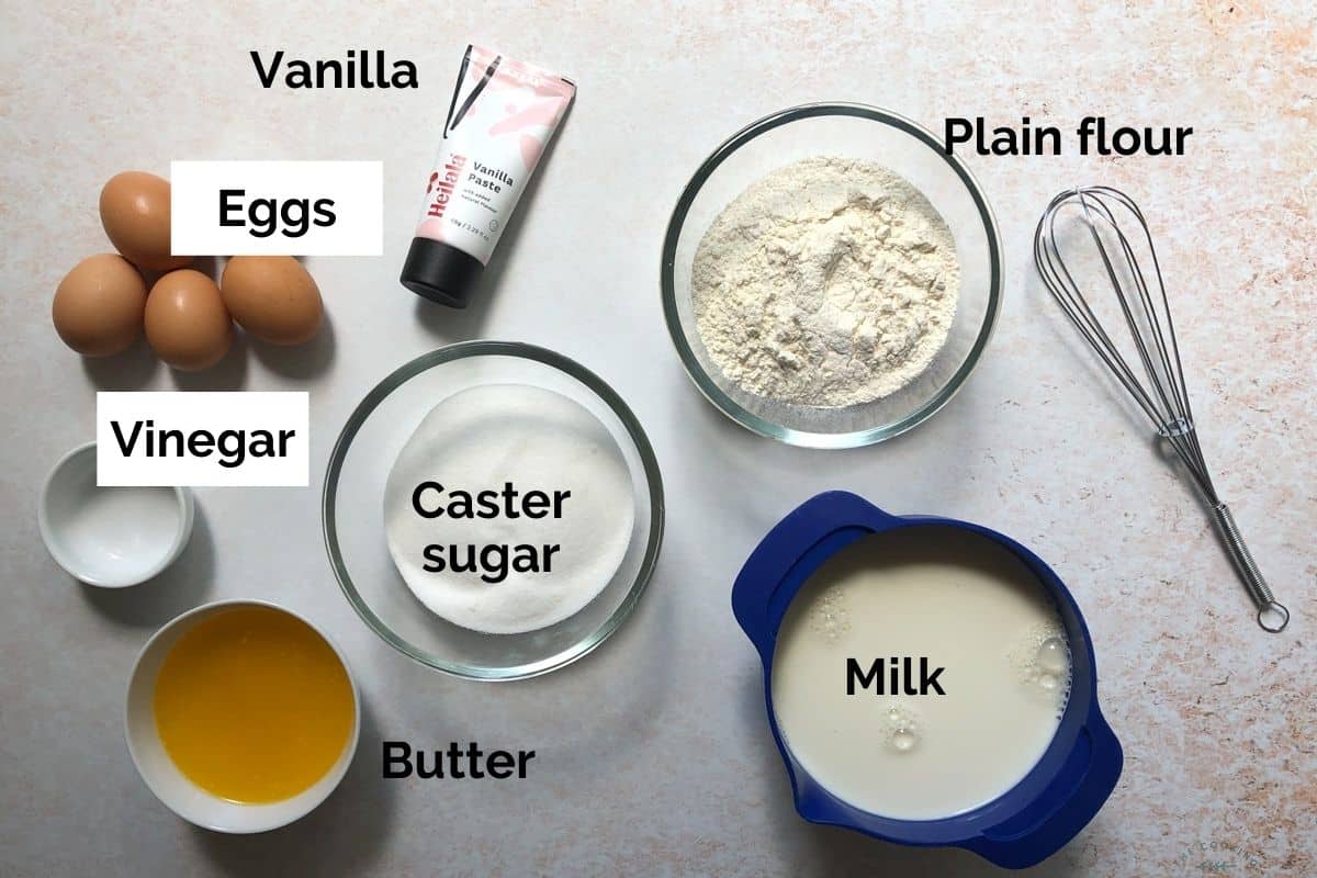 all ingredients for magic custard cake laid out on a table