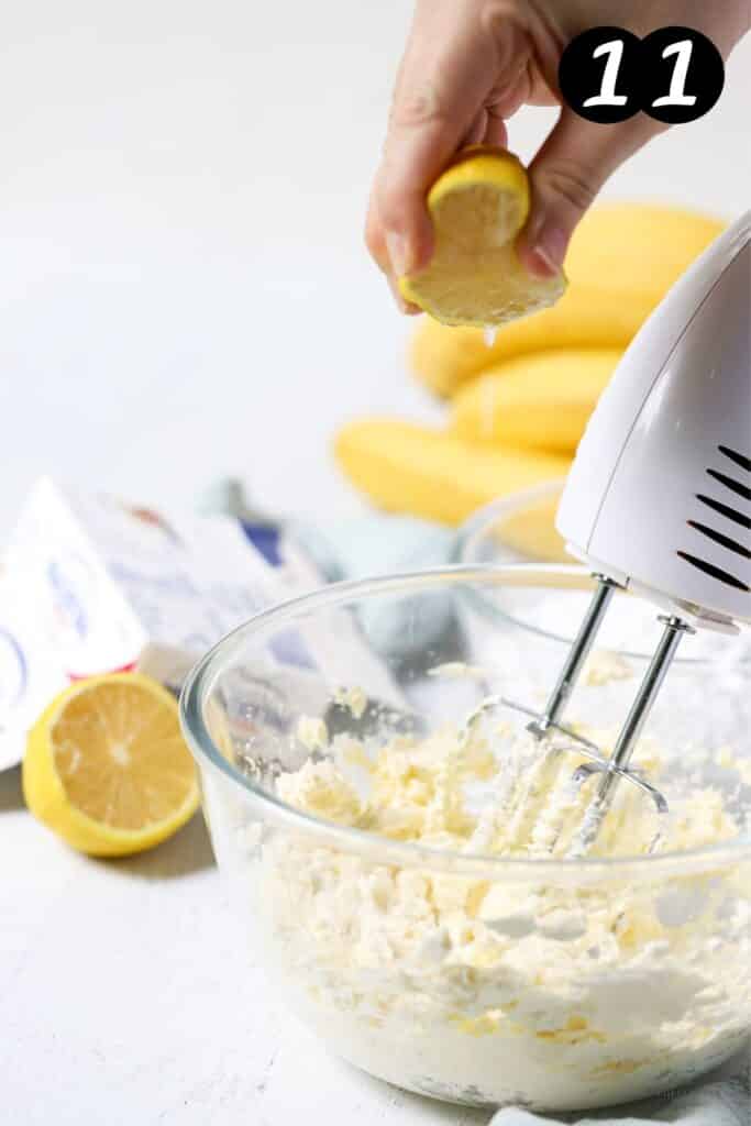 electric beaters mixing cream cheese frosting in a bowl