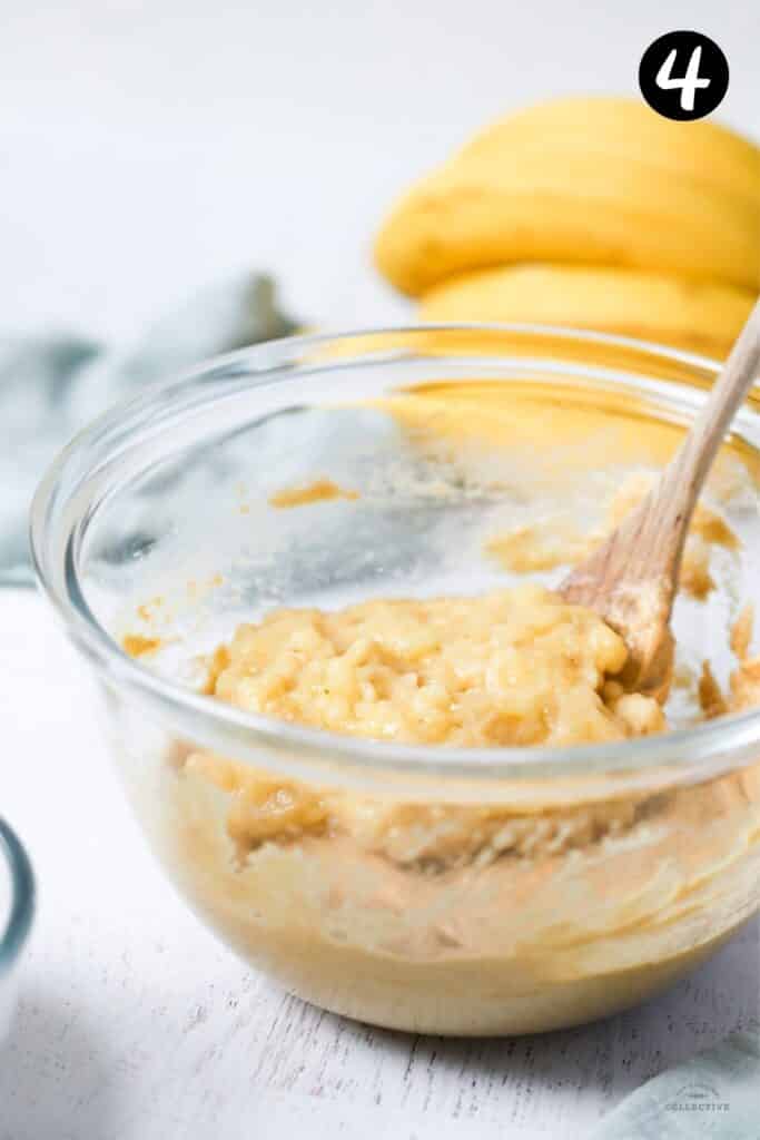 mashed banana and oil added to cake mixture in a bowl