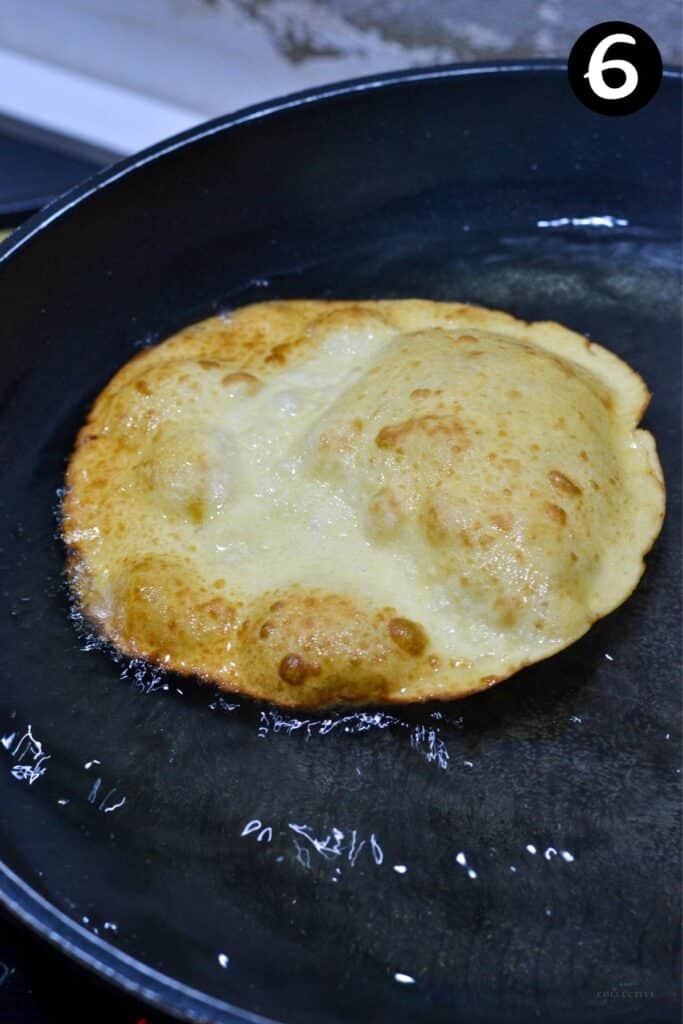 a browned tortilla in oil