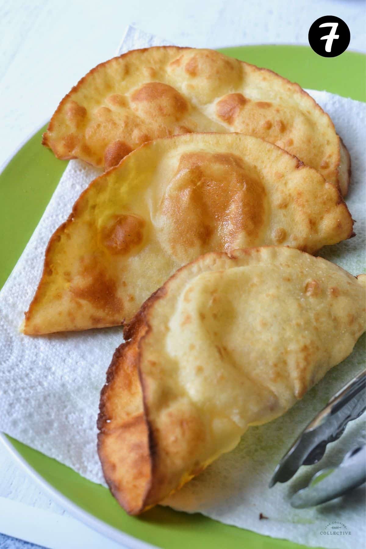 homemade taco shells on a green plate