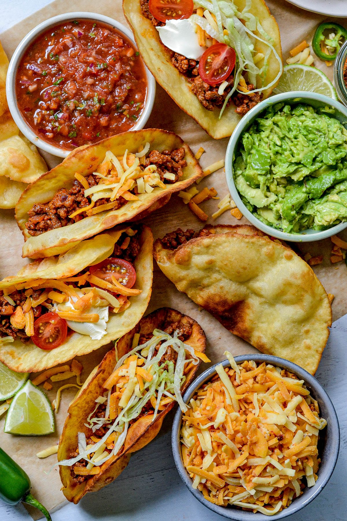 top view of beef tacos topped with salad