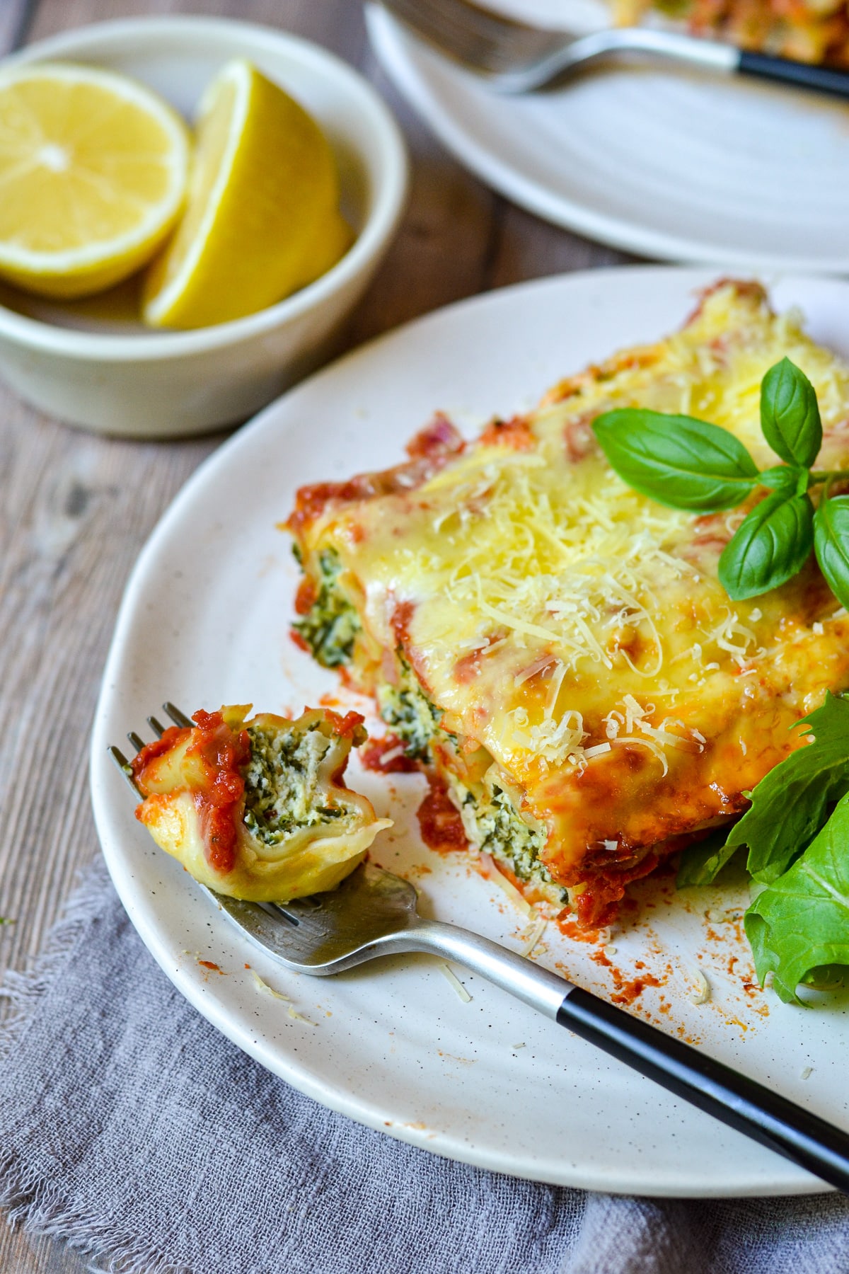 spinach and ricotta cannelloni on a grey plate