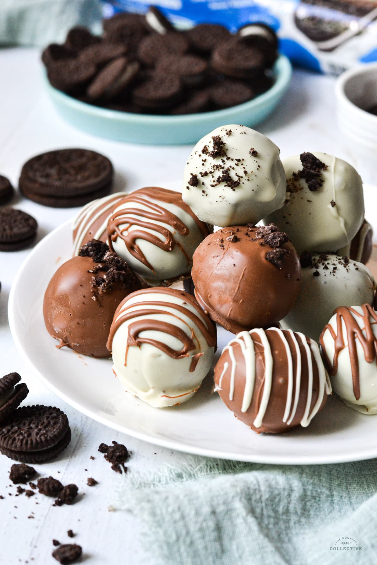 oreo balls covered in chocolate on a white plate