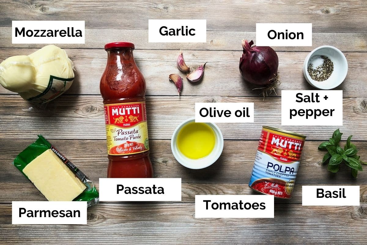 all ingredients for napoletana sauce laid out on a table