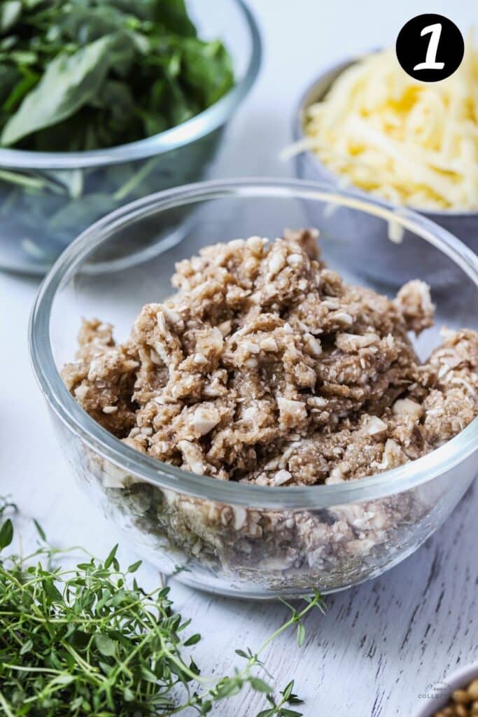 very finely chopped mushrooms in a glass bowl