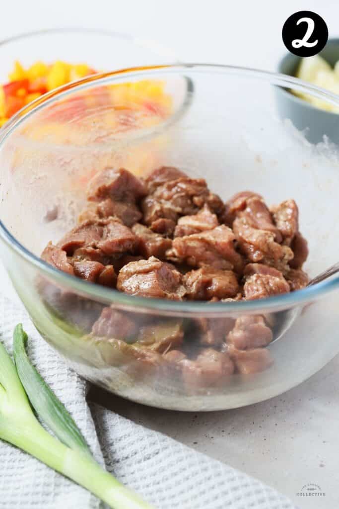 marinated pork pieces in a glass bowll