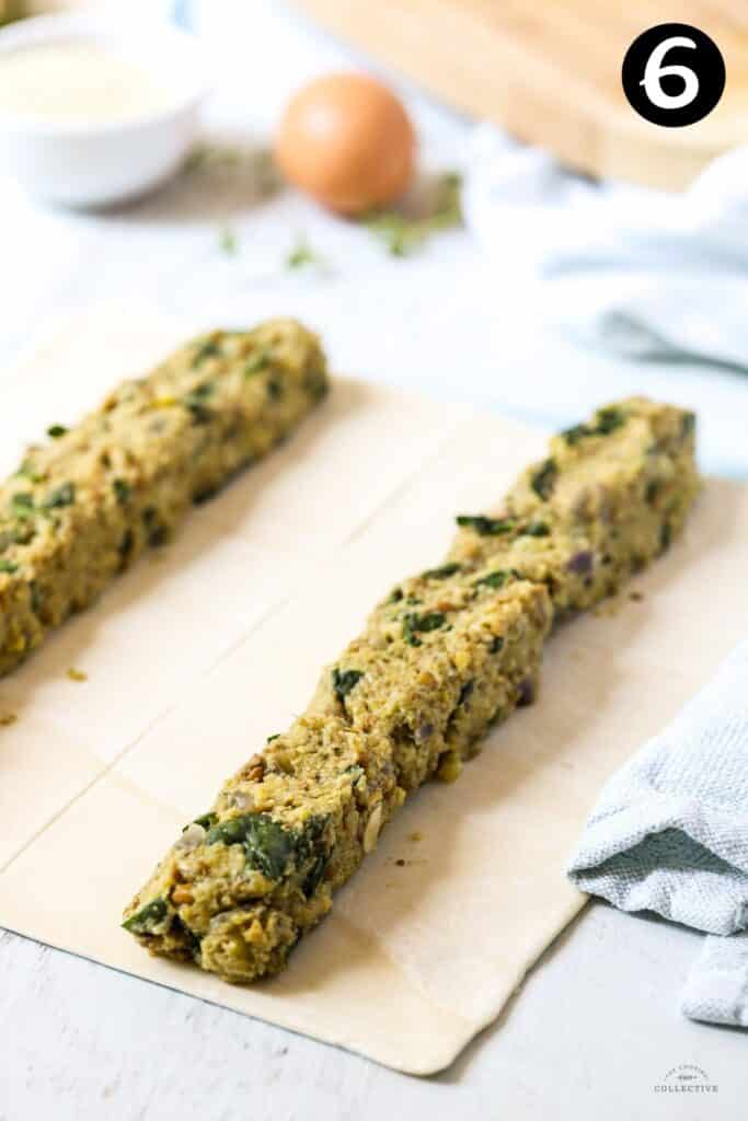 vegetarian filling divided over puff pastry sheets