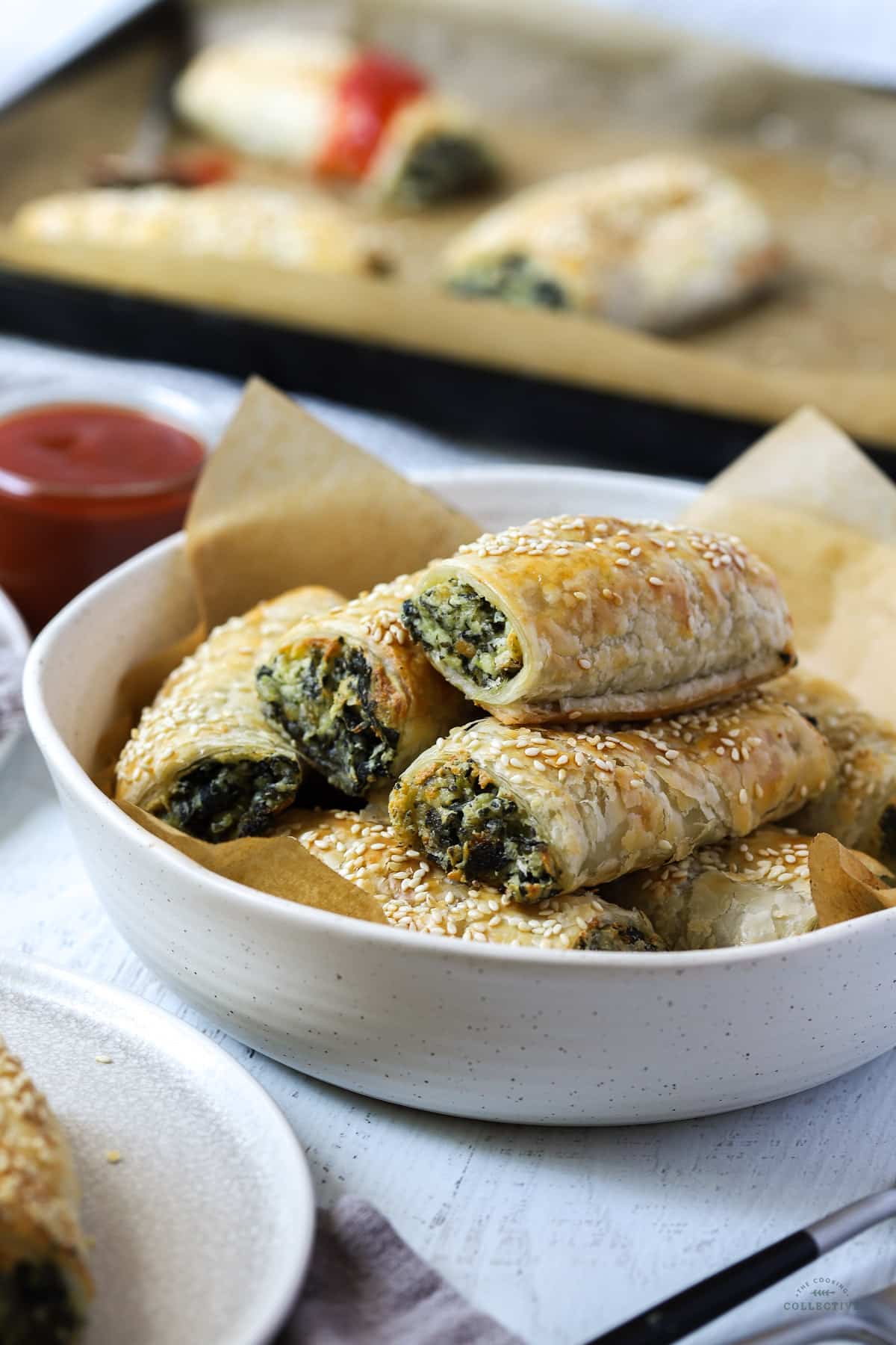 spinach and ricotta rolls in a white bowl